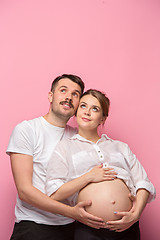 Image showing The handsome man and his beautiful pregnant wife\'s tummy