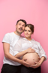 Image showing The handsome man and his beautiful pregnant wife\'s tummy