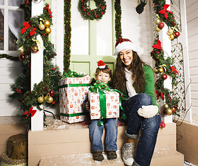 Image showing happy family on Christmas in red hats