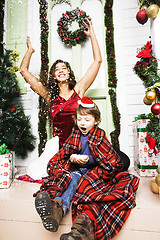 Image showing happy family on Christmas in red hats