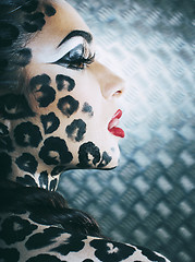 Image showing young sexy woman with leopard make up all over body, cat bodyart