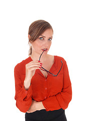 Image showing Business woman with glasses in mouth.