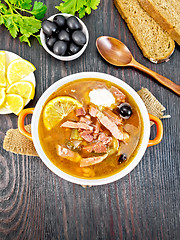 Image showing Solyanka with lemon in bowl on board top