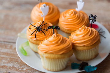 Image showing halloween party decorated cupcakes on plate