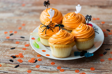 Image showing halloween party decorated cupcakes on plate