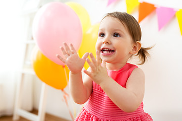 Image showing happy baby girl on birthday party at home