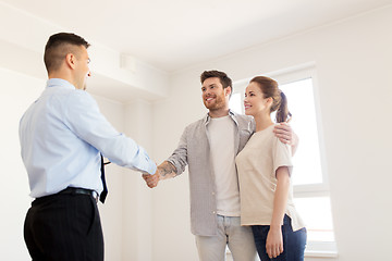 Image showing man and realtor shaking hands at new home