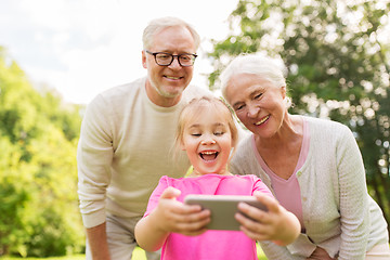Image showing senior grandparents and granddaughter selfie