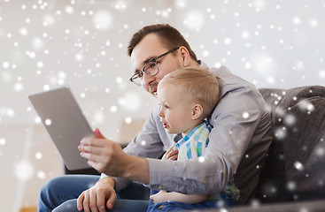 Image showing father and son with tablet pc playing at home