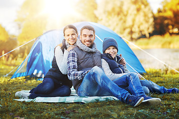 Image showing happy family with tent at camp site