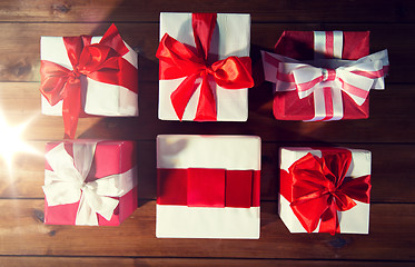 Image showing close up of gift boxes on wooden floor from top
