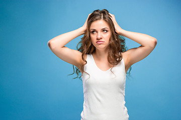 Image showing Portrait of young woman with shocked facial expression