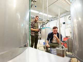 Image showing men with tablet pc at craft beer brewery filter