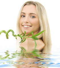 Image showing happy blonde with bamboo