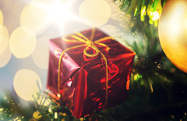 Image showing close up of gift box decoration on christmas tree