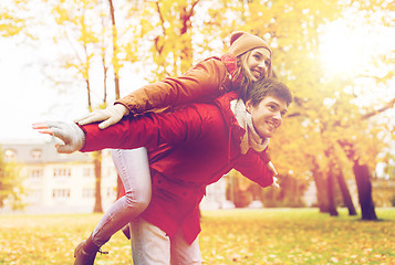 Image showing happy young couple having fun in autumn park