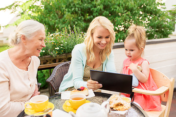 Image showing mother, daughter and grandmother with tablet pc