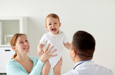 Image showing happy woman with baby and doctor at clinic