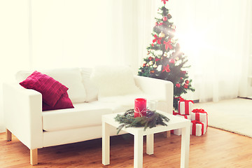 Image showing sofa, table and christmas tree with gifts at home