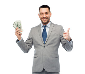 Image showing smiling businessman with american dollar money