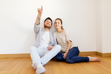 Image showing happy couple at empty room of new home