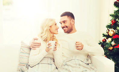 Image showing happy couple at home with christmas tree