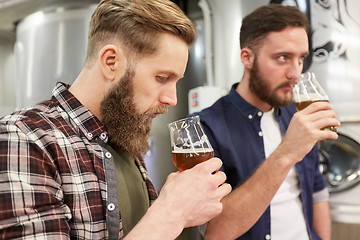 Image showing men testing non-alcoholic craft beer at brewery