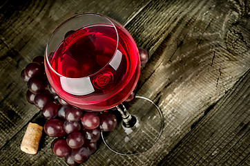 Image showing Glass of red wine with grapes