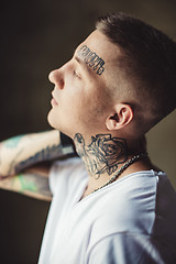 Image showing Trendy young man in tattoos