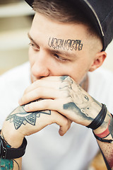 Image showing Handsome man in tattoos posing