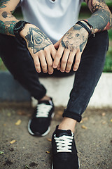 Image showing Crop tattooed man outside