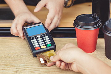 Image showing Person paying bill in cafe