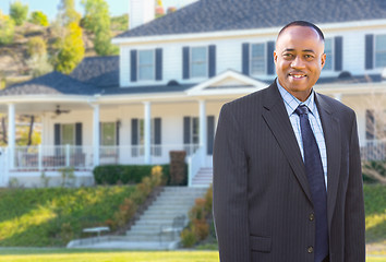 Image showing African American Agent In Front of Beautiful Custom House.