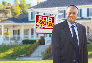 Image showing African American Agent In Front of Beautiful Custom House and So