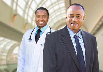 Image showing African American Businessman and Doctor Inside Medical Building.