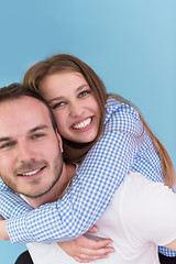 Image showing young man piggybacking his girlfriend