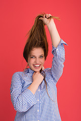 Image showing woman playing with her long silky hair