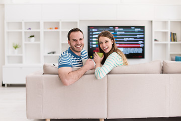 Image showing young handsome couple enjoying morning coffee