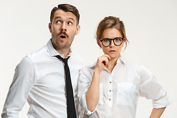 Image showing The business man and woman communicating on a gray background