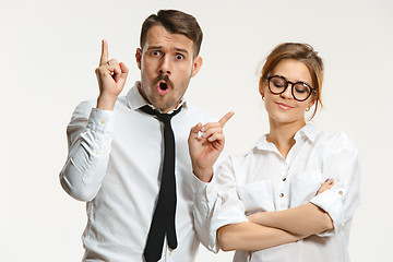 Image showing The business man and woman communicating on a gray background