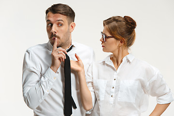 Image showing The business man and woman communicating on a gray background