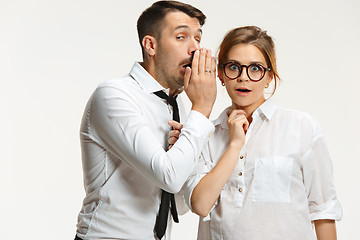 Image showing The business man and woman communicating on a gray background