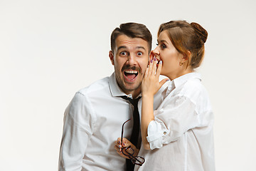 Image showing The business man and woman communicating on a gray background