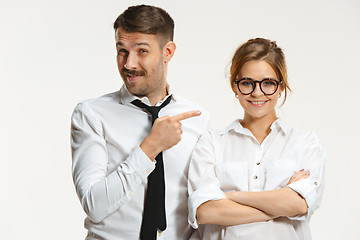 Image showing The business man and woman communicating on a gray background