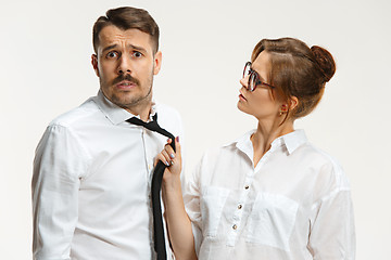 Image showing The business man and woman communicating on a gray background