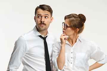 Image showing The business man and woman communicating on a gray background