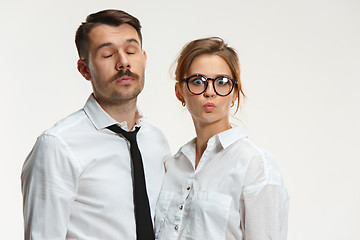 Image showing The business man and woman communicating on a gray background