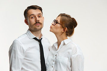 Image showing The business man and woman communicating on a gray background