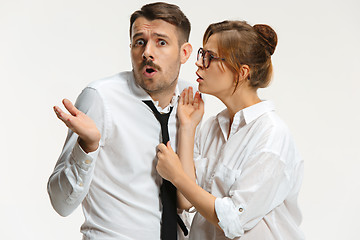 Image showing The business man and woman communicating on a gray background