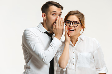 Image showing The business man and woman communicating on a gray background